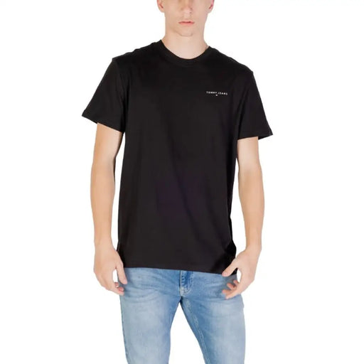 Black Tommy Jeans short sleeve T shirt displayed in a product image