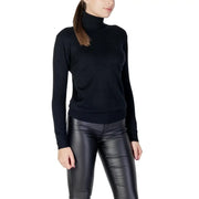 Pull en maille noire à col roulé et manches longues pour femme, avec poignets côtelés