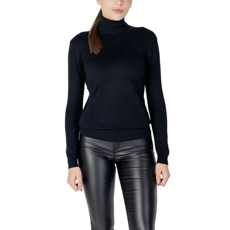 Pull en maille noire à col roulé et manches longues pour femme, col et poignets côtelés