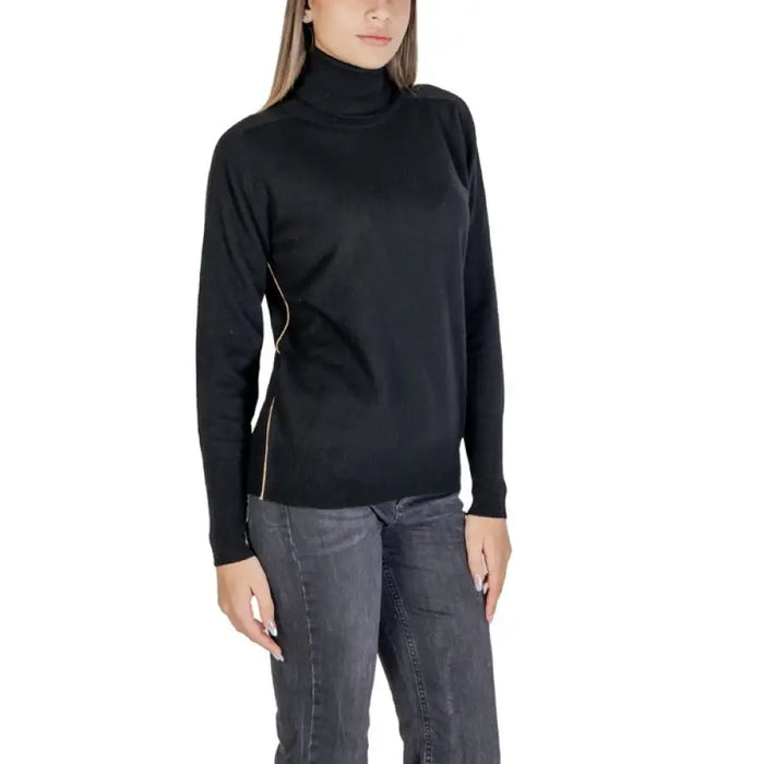 Black turtleneck sweater featuring stylish side zippers for a modern look