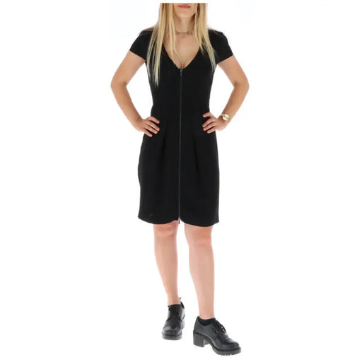 Black V-neck sheath dress with front zipper and back cutout for elegant style