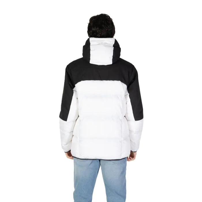 Black and white two-tone hooded puffer jacket displayed in product image