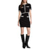Black and white knit dress with front pockets styled with fashionable boots