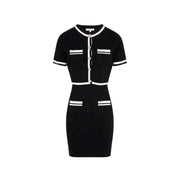 Black and white knit dress from Morgan De Toi featuring front pockets and short design
