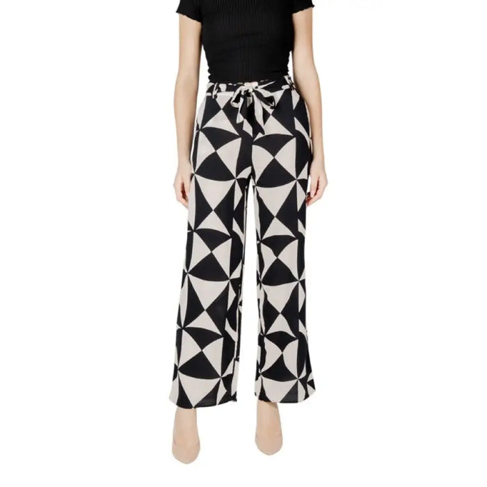 Black and white patterned palazzo pants featuring geometric design and laces for women