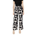 Black and white patterned palazzo pants featuring geometric design and laces for women