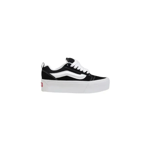 Black and white platform sneaker displayed in the product images