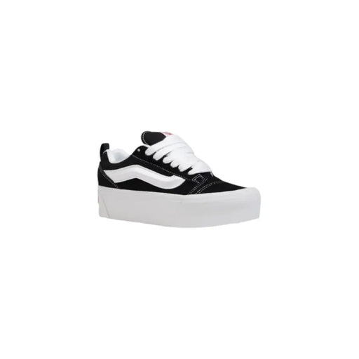 Black and white platform sneaker displayed in the product listing