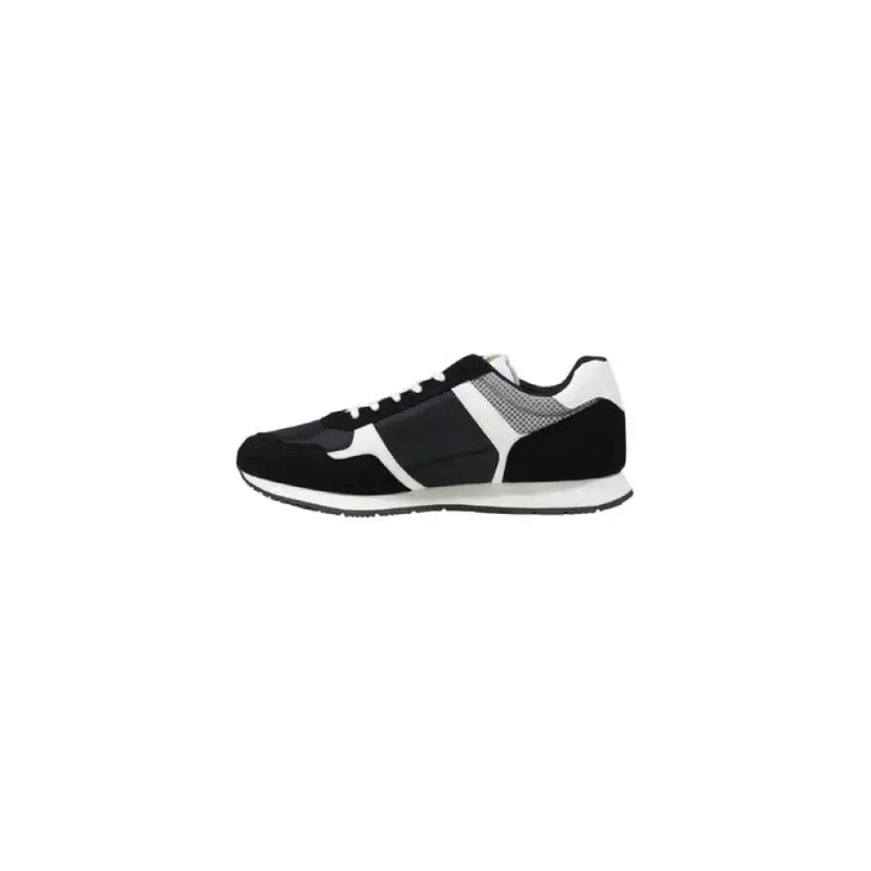 Black and white Tommy Hilfiger sneaker displayed in a high-quality product image