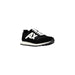 Black and white AX Running Sneaker displayed in a product image