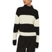Black and white striped turtleneck sweater displayed on a clothing mannequin