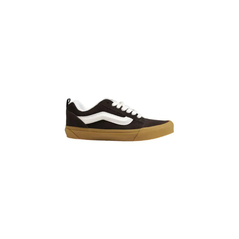 Black and white Vans sneaker displayed with Vans Men’s Brown Leather Sneakers