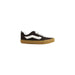 Black and white Vans sneaker displayed with Vans Men’s Brown Leather Sneakers