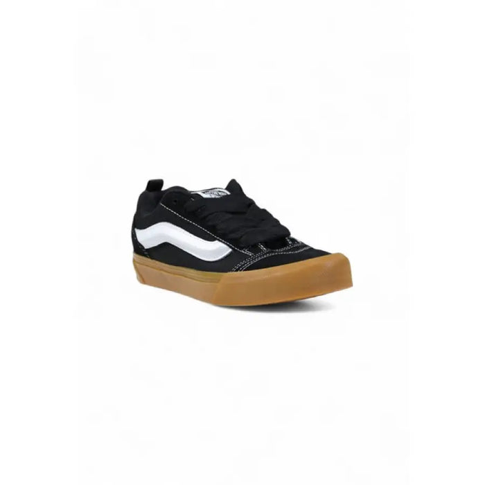 Black and white Vans sneaker with gum sole for stylish casual wear