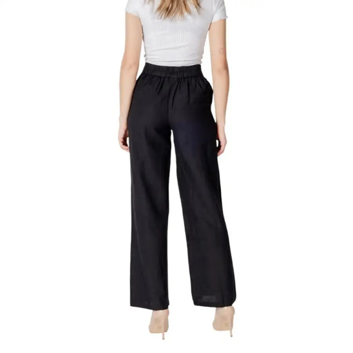 Black wide-leg pants with white embroidery, perfect for stylish and comfortable wear