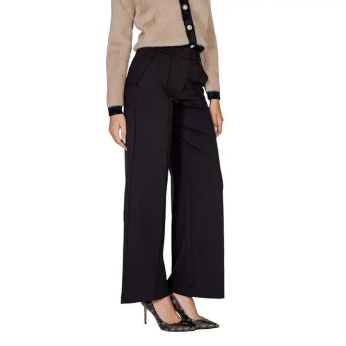 Elegant Black Flared Trousers featuring a stylish wide-leg design for versatile outfits