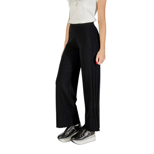 Liu Jo Women Black Fall Winter Trousers with wide-leg design and platform sneakers