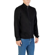 Black zip-up jacket with ribbed cuffs and waistband, made of cotton blend.