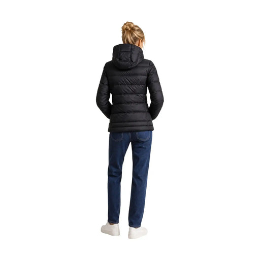 Blauer Doudoune matelassée noire en polyamide pour femme, avec capuche, présentant un design de vêtement d'extérieur d'hiver isolé