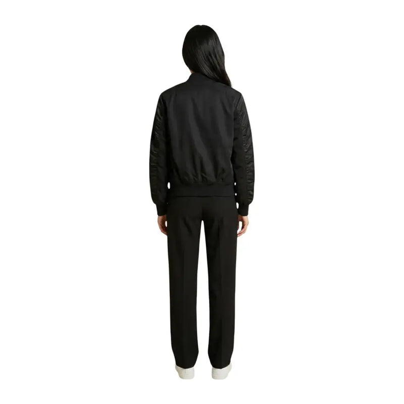 Blauer women black zip blazer with pockets featuring smooth fabric body and textured sleeve panels with ribbed cuffs