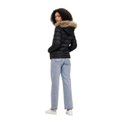 Black quilted puffer jacket by Blauer women with nylon fabric and tan fur-lined hood for cold weather use