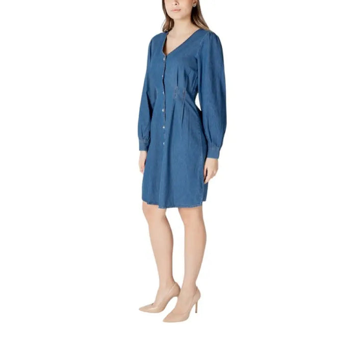 Blue long sleeve denim dress featuring a classic button-down design