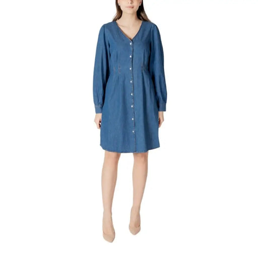 Blue long sleeve denim dress with button-down design displayed in product image