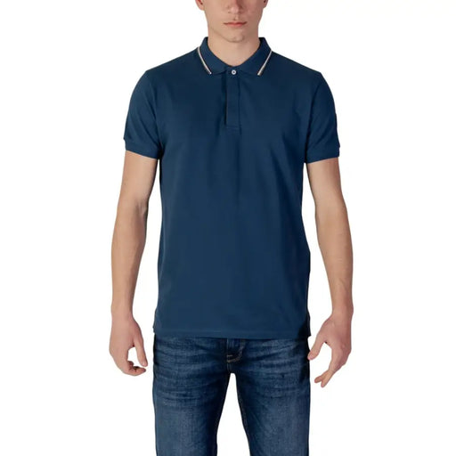 Navy blue polo shirt with white tipping and collar, made of cotton.
