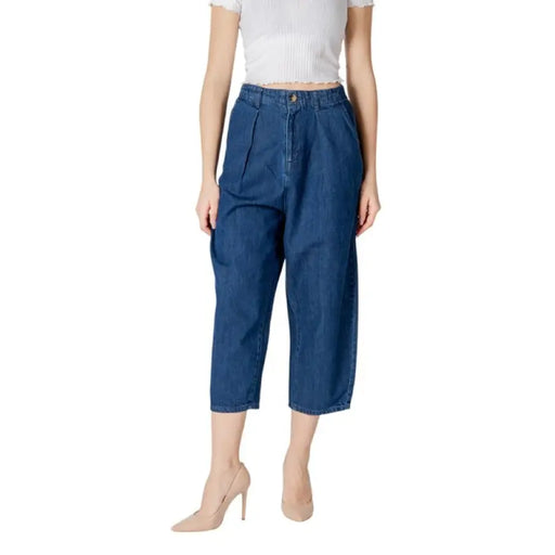 Blue denim culottes paired with beige heels displayed in a fashion product image
