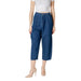Blue denim culottes paired with beige heels displayed in a fashion product image