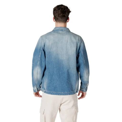 Light Blue Denim Jacket displayed on a mannequin against a neutral backdrop