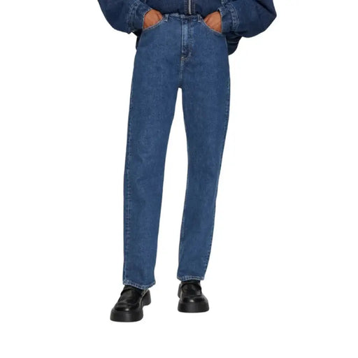 Blue denim jeans with black loafers photographed for the Blue Denim Jeans with Denim Jacket and Black Loafers product display