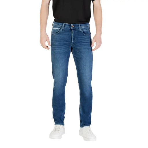 Mens Blue Denim Jeans displayed for sale in a retail store