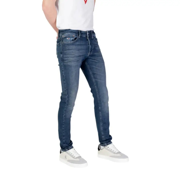Blue denim slim-fit jeans by Tommy Hilfiger featuring front and back pockets