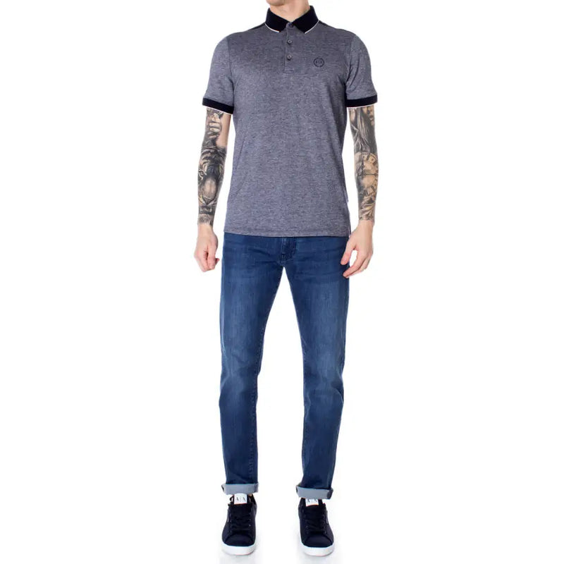 Gray and black polo shirt with contrast tipping, slim fit jeans, dark blue sneakers.