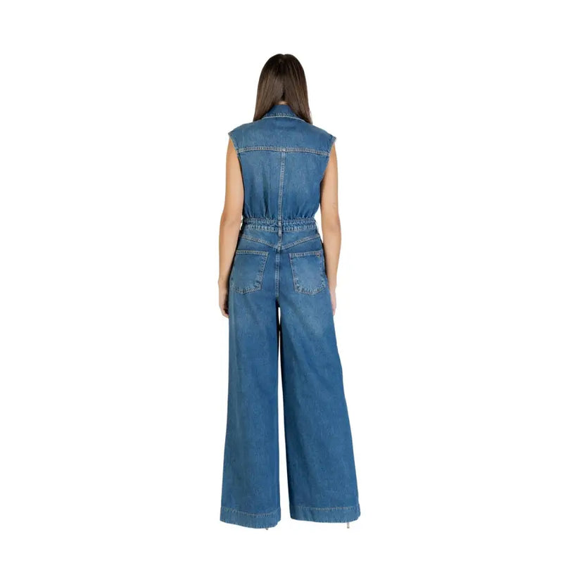 Blue denim sleeveless jumpsuit with wide legs and back pockets shown from the back by colcci