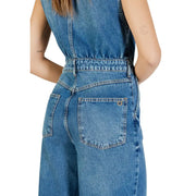 Blue sleeveless denim jumpsuit by colcci with relaxed fit and back pockets featuring stitched edges and metal rivets