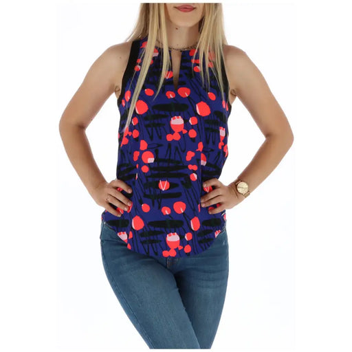 A navy blue sleeveless top featuring a playful red and black abstract pattern for casual wear