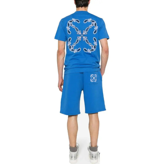 Blue short-sleeved t-shirt and shorts set displayed for casual wear over a white background