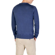 Navy blue crew neck sweater with ribbed cuffs and hem, likely made of cotton or polyester blend.