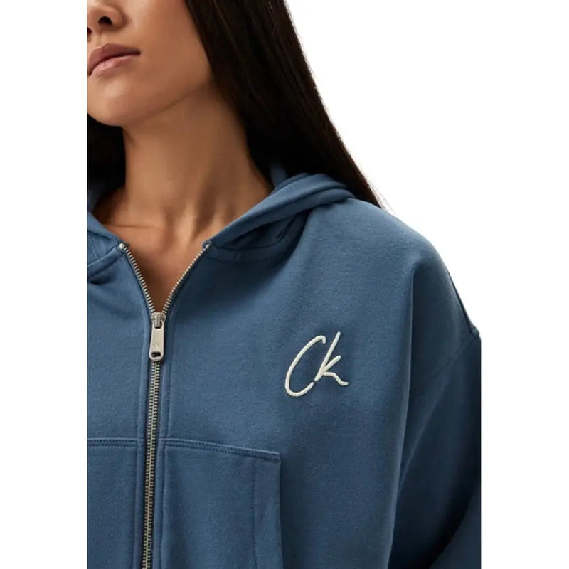 Blue cropped zip-up hoodie shown in a modern fashion product image
