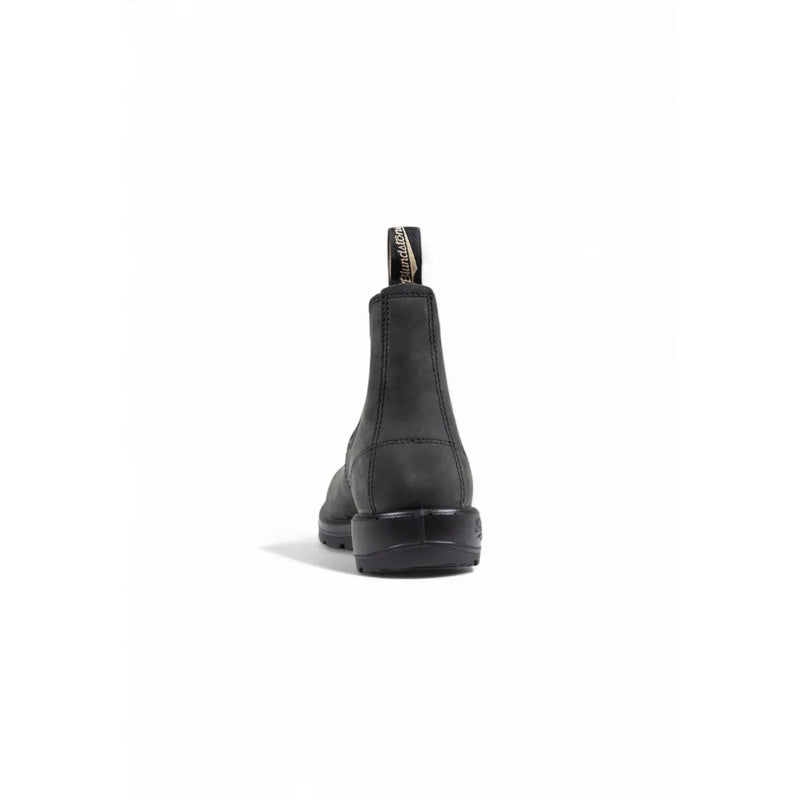 Bottines Blundstone pour homme en cuir noir, à talon apparent, avec semelle en caoutchouc robuste et languette de tirage.