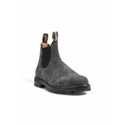 Bottines Blundstone pour homme en cuir noir, modèle Chelsea en daim gris foncé, semelle en caoutchouc noir et languettes de tirage.