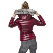 Bordeaux women’s hooded jacket with belt and pockets featuring a shiny quilted maroon puffer and faux fur-lined hood