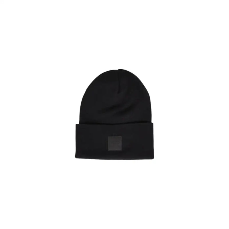 Black beanie with a square patch on the front, likely made of wool or acrylic.