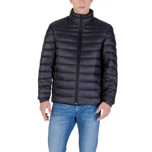Black quilted down jacket with zipper and high collar.