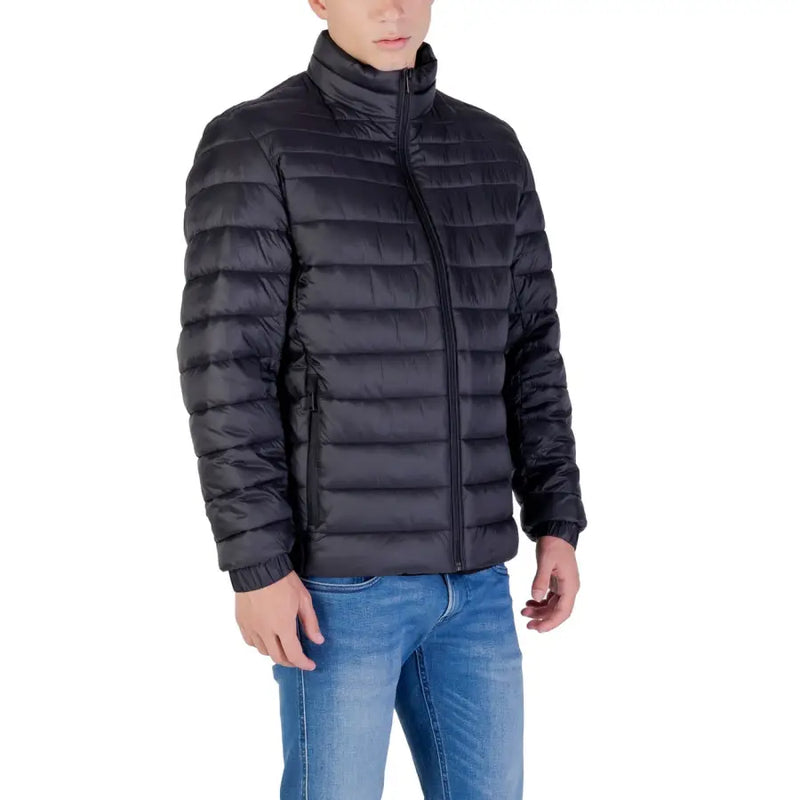 Black quilted down jacket with high collar and zipper closure.