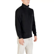 Black zip-up jacket with a high collar and pocket detail, likely made of polyester or cotton blend.