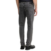 Jean gris Boss pour homme, coupe slim, en coton stretch, avec poches classiques à l'arrière.