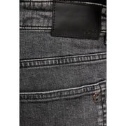 Jean slim en coton stretch noir, coupe slim, délavage subtil et étiquette de marque en cuir noir à l'arrière.